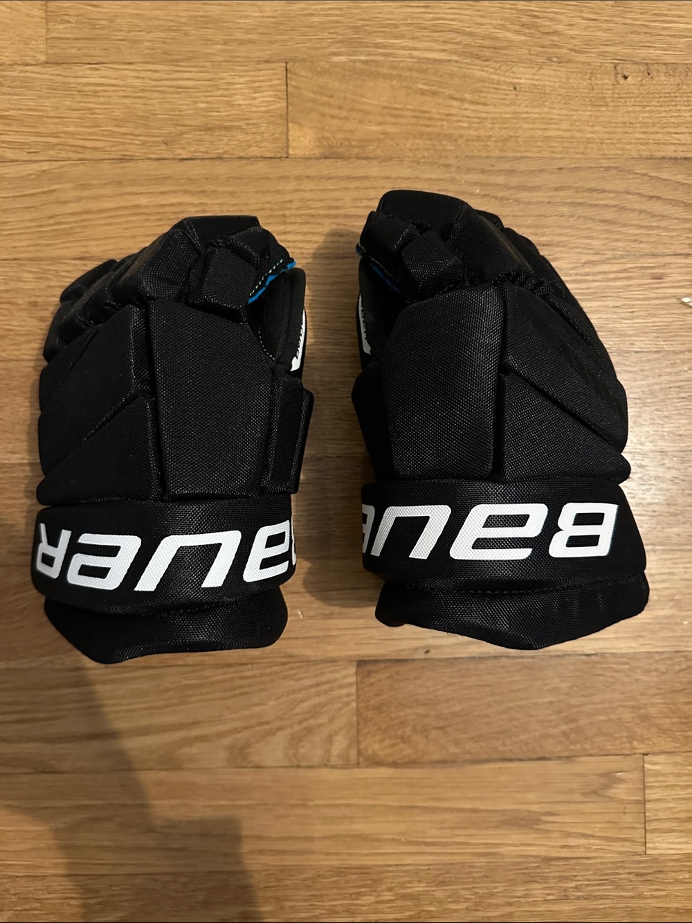 Junior 11” Bauer Black and White Hockey Gloves with Subtle Blue Accent